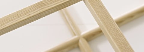 Partial overhead view of the wood frame of a Loophole Table.