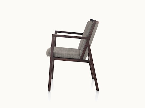 An Ascribe side chair with gray upholstery and a wood frame with a dark finish, viewed from the side.