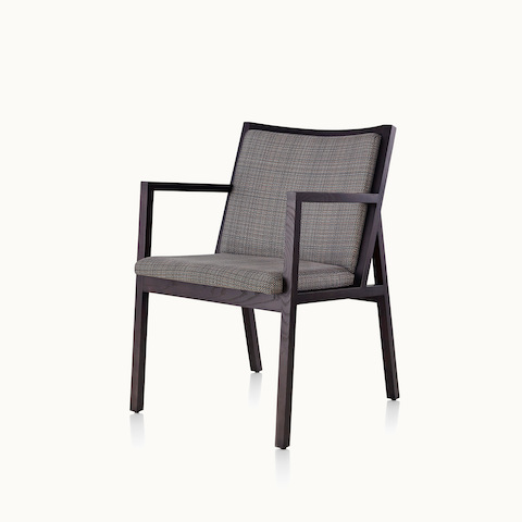 Angled view of an Ascribe side chair with gray upholstery and a wood frame. Select to go to the Ascribe Chair product page.