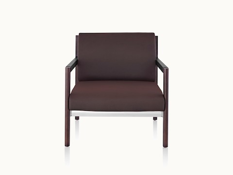 A Brabo club chair with dark brown upholstery, leather and metal accents, and an exposed wood frame, viewed from the front.