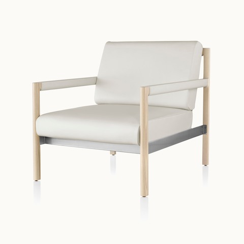Angled view of a Brabo club chair with off-white leather upholstery, leather and metal accents, and an exposed wood frame.