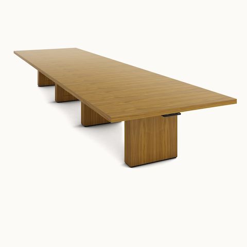 JD Conference Table in a light wood finish, white sweep angled view. 