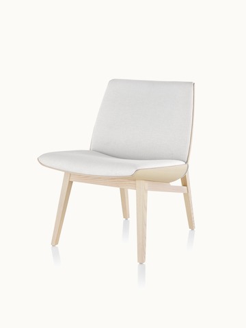 Angled view of a low-back Clamshell Lounge Chair with off-white fabric upholstery and four wood legs.