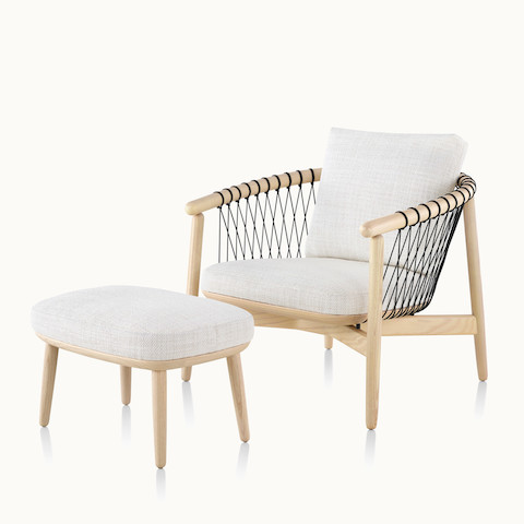 Angled view of a Crosshatch lounge chair and ottoman with off-white fabric. Select to go to the Crosshatch Chair and Ottoman product page.