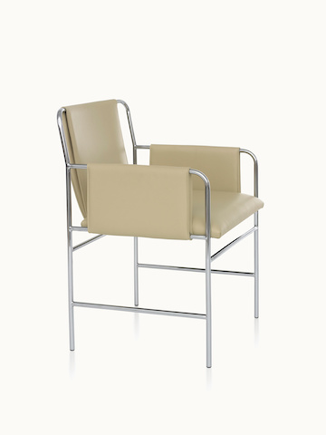 Angled view of an Envelope side chair with beige leather upholstery and a tubular steel frame.