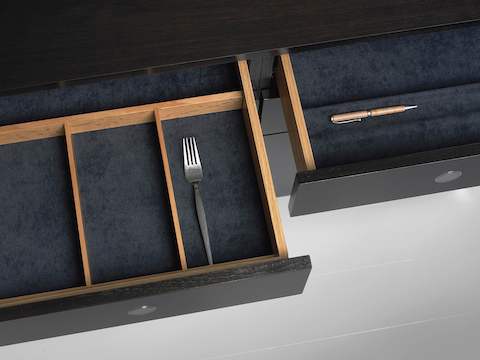 Overhead view of two open drawers in an H Frame Storage credenza, showing optional inserts for organizing supplies.