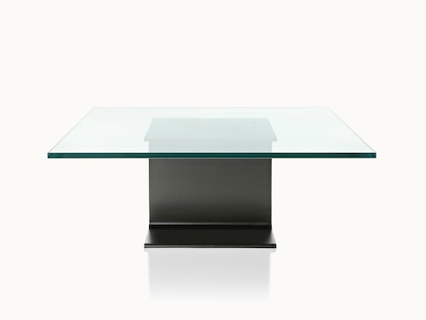 A glass-top I Beam coffee table, oriented to display the cast-aluminum pedestal's central section.