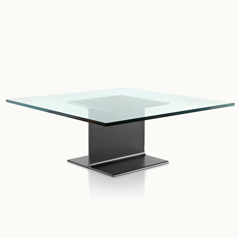 Angled view of a square I Beam coffee table with a glass top and black cast-aluminum pedestal.