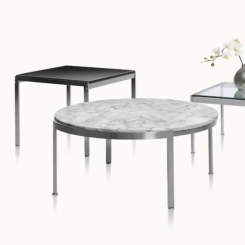 Three occasional tables with different top materials and shapes. Select to go to the Metal Series Tables product page.