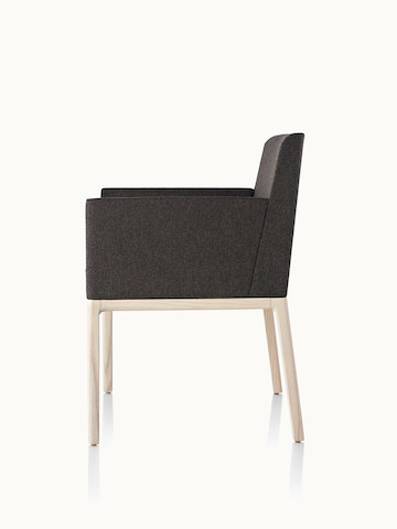 Side view of a Nessel side chair with black fabric upholstery, wraparound arms, and a wood frame with a light finish.