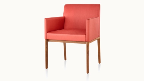 Angled view of a Nessel side chair with wraparound arms, red upholstery, and a wood frame with a medium finish.