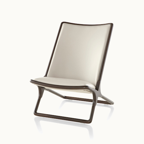 Angled view of a Scissor lounge chair with ivory-colored leather upholstery. Select to go to the Scissor Chair product page.
