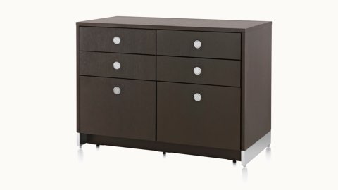 Angled view of a Sled Base Storage unit with a dark wood finish, four box drawers, and two file drawers.