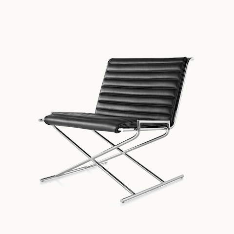 Angled view of a Sled lounge chair with black leather upholstery and an X-shaped steel frame. Select to go to the Sled Chair product page.