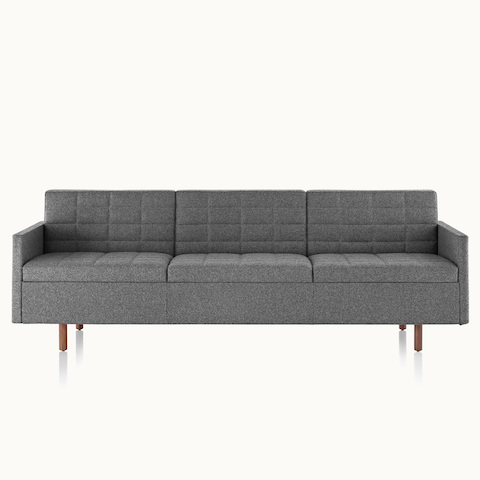 A Tuxedo Classic sofa with dark gray quilted upholstery, viewed from the front.