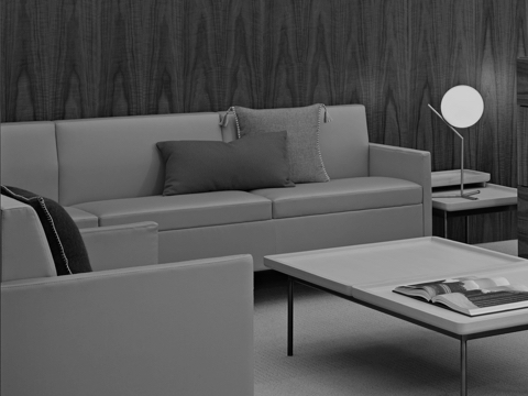 Black-and-white image of a sitting area featuring Tuxedo Classic Lounge Seating and a Tuxedo Component coffee table.