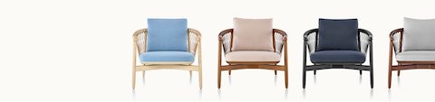 Four Crosshatch lounge chairs in various fabrics and finishes, viewed from the front.